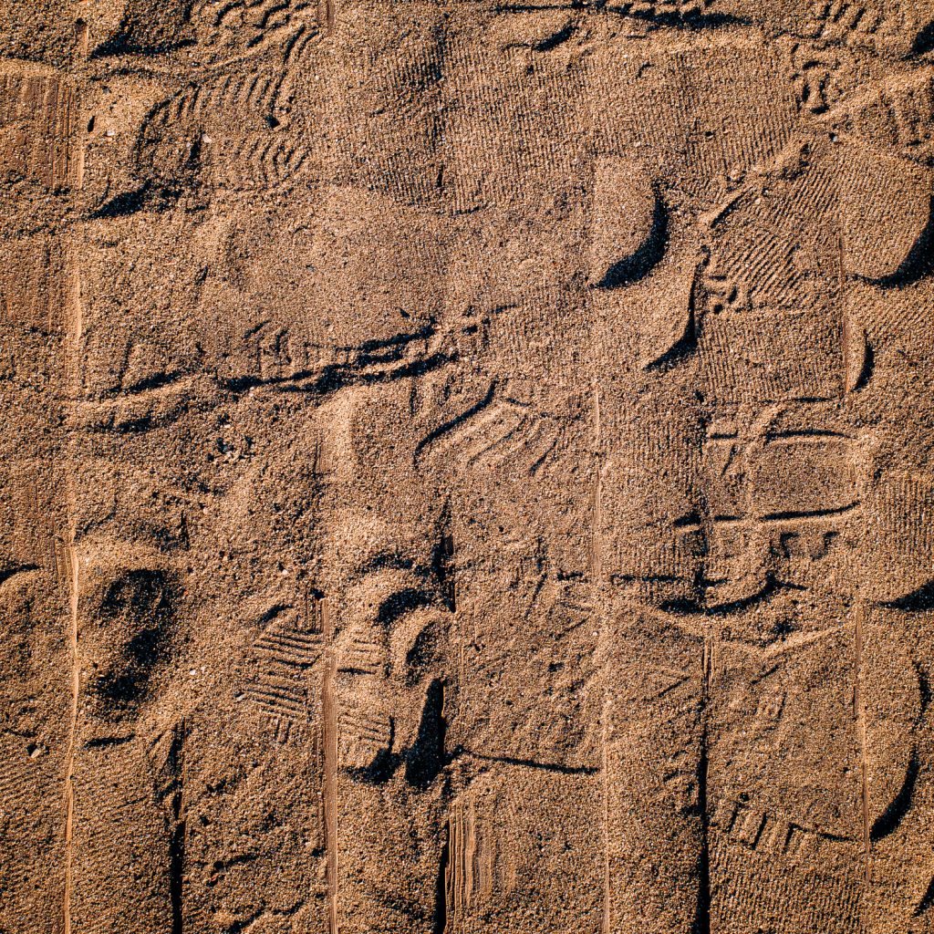 Stone wall with raised recesses arranged in regular rows